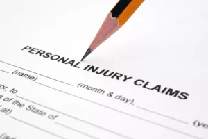 Close-Up Of A Pencil Pointing To A Form Labeled 'Personal Injury Claims,' Representing Personal Injury Resources.
