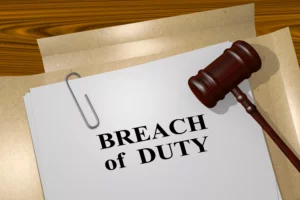 Legal Document Titled &Quot;Breach Of Duty&Quot; With A Gavel Resting Beside It, Representing A Core Element In Personal Injury And Negligence Cases.